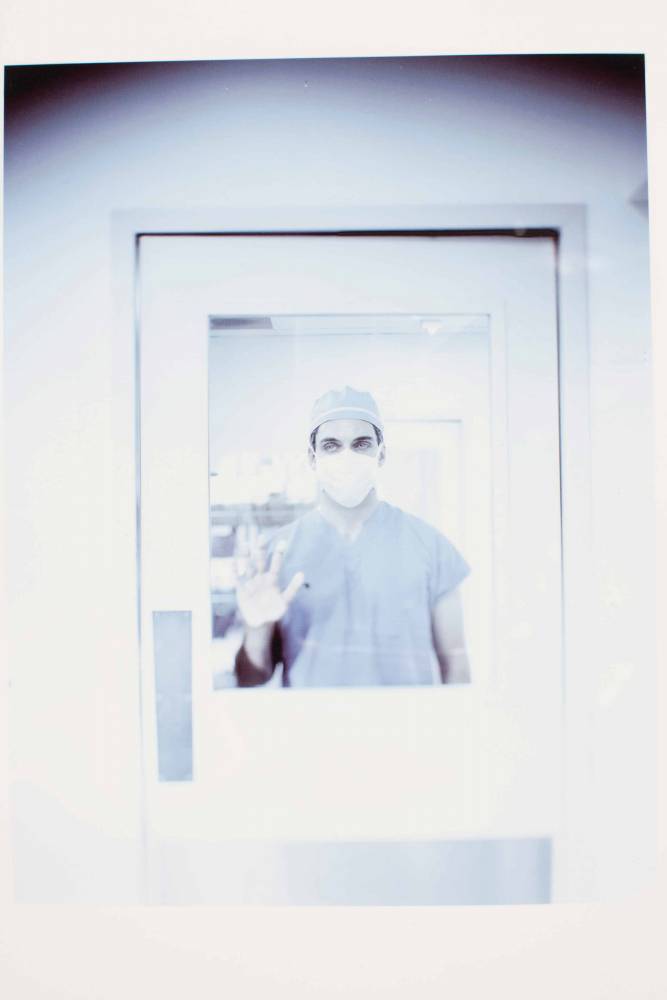 Surgeon, entering operating room. St Joseph Hospital, Houston. Texas